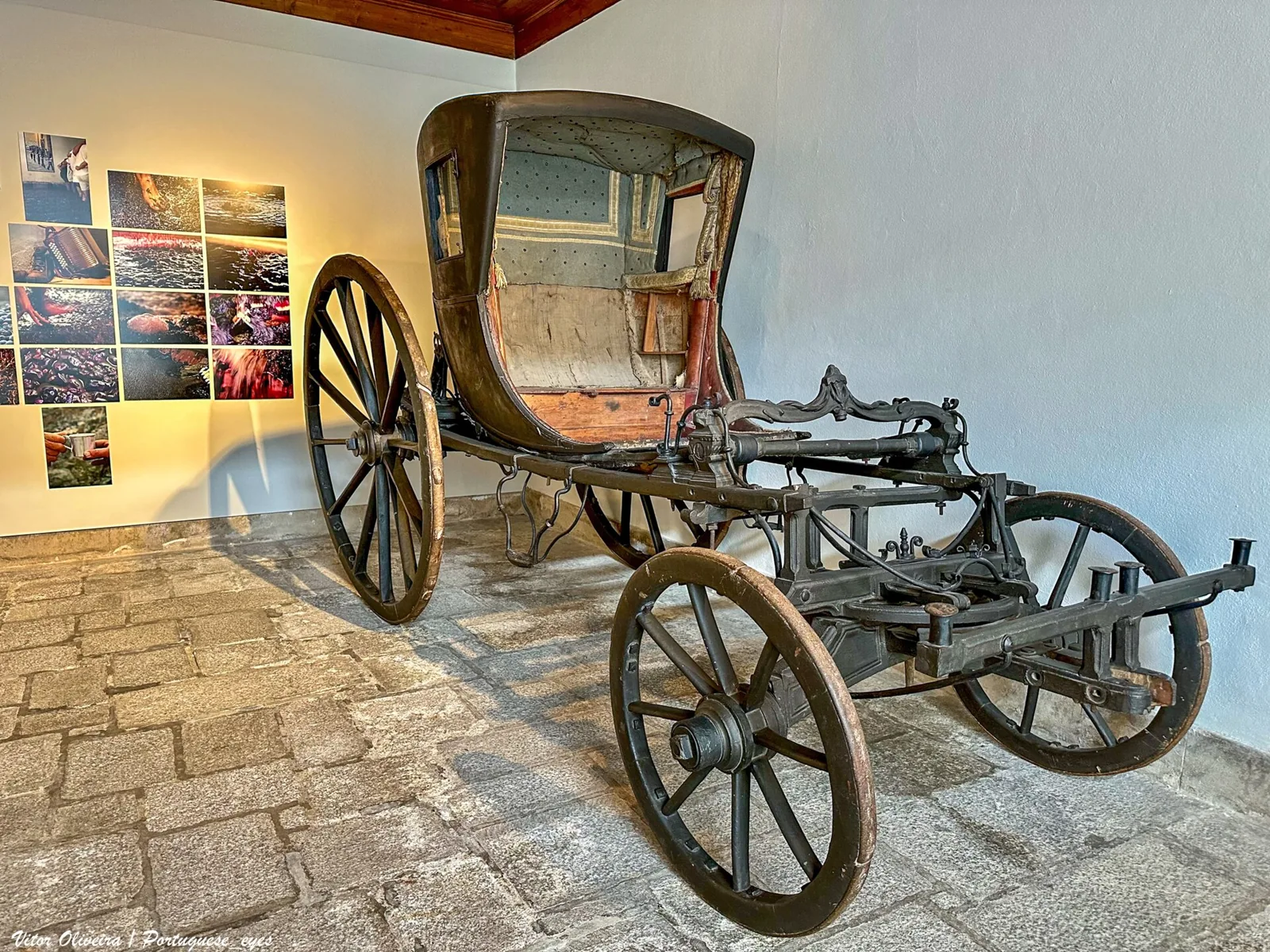 Antique carriage on display in a room of the Lamego Museum